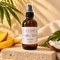 ELARI After Glow coconut mango body elixir in a 4 oz amber pump bottle
